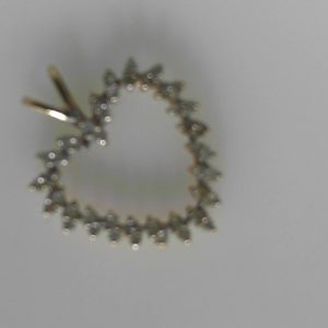 Estate Diamond Pendant/Necklace 
10 Karat Yellow Estate Diamond Pendant 
Gram Weight 1.63 Chain Style: No Chain 
42 Center Diamonds Shape: Round; Clarity: I3