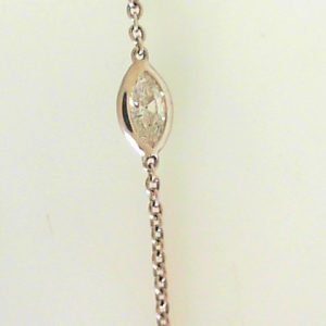 Estate Diamond Pendant/Necklace 
18 Karat White Estate Diamond Pendant 
Gram Weight 3.32 Chain Style: Cable Link 18 Karat White 24 
3 Center Diamonds Shape: Marquise; Clarity: VS; Colour: I With 8 Marquise Diamonds 0.24 ctw 0.66