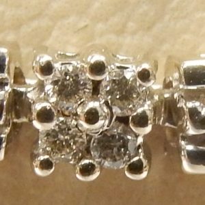 Estate Diamond Bracelet 
14 Karat White Estate Diamond Bracelet Width: 0.25mm 
Gram Weight 8.66 
56 Center Diamonds Shape: Round; Clarity: I1; Colour: J/K 0.46