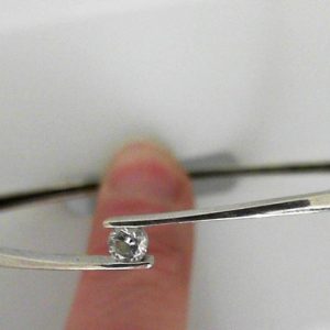 Estate Diamond Bracelet 
10 Karat White Estate Diamond Bracelet 
Gram Weight 6.36 
1 Center Diamond 0.23ct Shape: Round; Clarity: I1; Colour: I 0.23