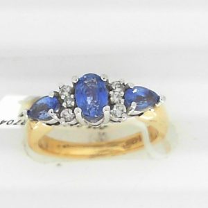 Tanzanite Ring 
14 Karat Yellow/White Tanzanite Ring With Finger Size 6.25 
Width 2.38mm Gram Weight 5.01 
1 Center Tanzanite Shape: Oval With 2 Pear Tanzanites and 4 Round Diamonds 0.02 ctw and 2 Round Diamonds 0.015 ctw