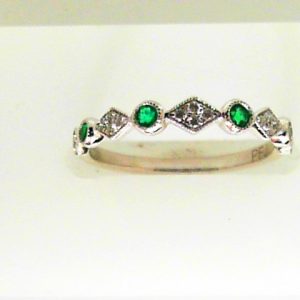 Emeralds Ring 
18 Karat White Emeralds Ring 
 
4 Center Emeralds Shape: Round With 14 Round Diamonds 0.09 ctw