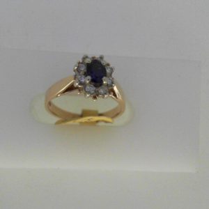 Sapphire Estate Ring 
14 Karat Yellow Sapphire Ring With Finger Size 4.5 
Width 2.31mm Gram Weight 2.48 
1 Center Sapphire Shape: Oval With 8 Round Diamonds 0.16 ctw