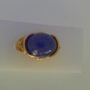 Tanzanite Estate Ring 
14 Karat Yellow Tanzanite Ring With Finger Size 5 
Width 1.9mm Gram Weight 5.3 
1 Center Tanzanite 6.55ct Shape: Cabochon With 2 Round Sapphires and 2 Round Diamonds