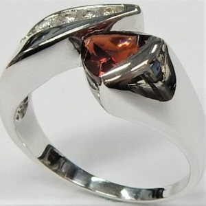 Garnet Estate Ring 
14 Karat White Garnet Ring With Finger Size 8.25 
 Gram Weight 5 
1 Center Garnet Shape: Trillian With 6 Round Diamonds 0.20 ctw