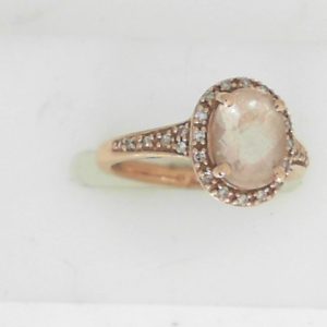 Morganite Estate Ring
10 Karat Rosé Morganite Ring With Finger Size 4.5
Gram Weight 2.53
1 Center Morganite Shape: Oval With 26 Round Diamonds