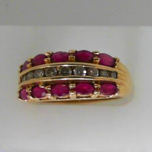 Rubies Estate Ring 
14 Karat Yellow Rubies Ring With Finger Size 7.25 
 Gram Weight 5.16 
10 Center Rubies Shape: Round With 10 Round Diamonds 0.25 ctw