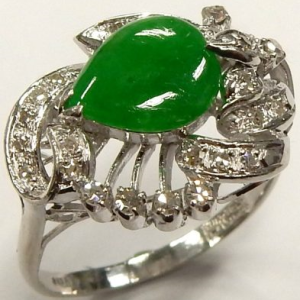 Jade Estate Ring 
Platinum White Jade Ring With Finger Size 8.75 
 Gram Weight 6.8 
1 Center Jade Shape: Pear With 27 Round Diamonds 0.20 ctw