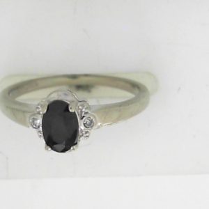 Sapphire Estate Ring 
10 Karat White Sapphire Ring With Finger Size 6.5 
 Gram Weight 1.86 
1 Center Sapphire Shape: Oval With 2 Round Diamonds