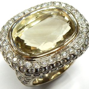Quartz Estate Ring
14 Karat White Greenish Yellow Quartz Ring With Finger Size 10
Width 28mm Gram Weight 48.8
1 Center Quartz 34.00ct Shape: Oval; Colour: Greenish Yellow With 240 Round Diamonds 8.40 ctw