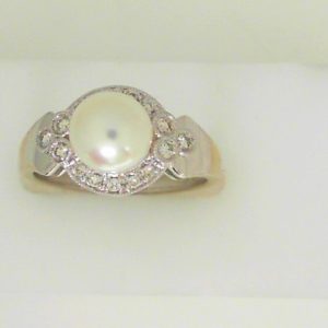 Pearl Estate Ring 
14 Karat White Pearl Ring With Finger Size 7.25 
 Gram Weight 4.08 
1 Center Pearl Shape: Round With 16 Round Diamonds 0.15 ctw