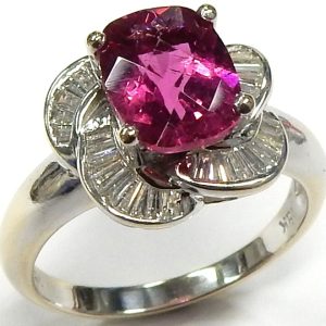 Tourmaline Estate Ring 
18 Karat White Pink Tourmaline Ring With Finger Size 7 
 Gram Weight 4.9 
1 Center Tourmaline 2.00ct Shape: Oval; Colour: Pink With 43 Baguette Diamonds 0.50 ctw