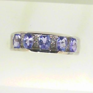 Tanzanites Estate Ring 
14 Karat White Tanzanites Ring With Finger Size 5 
 Gram Weight 2.72 
5 Center Tanzanites Shape: Oval With 8 Round Diamonds
