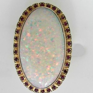 Opal Estate Ring
14 Karat Yellow Opal Ring With Finger Size 6
Gram Weight 18.1
1 Center Opal Shape: Oval With 35 Round Rubies