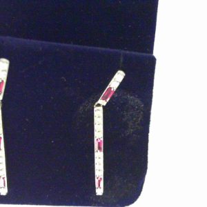 Earrings with Rubies 
14 Karat White Rubies Earrings 
 Gram Weight 5.7 
6 Center Rubies Shape: Baguette With 22 Round Diamonds 0.66 ctw