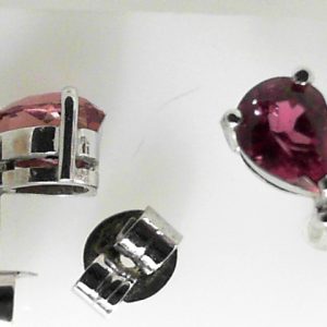 Estate Earrings With Tourmalines 
18 Karat White Pink Tourmalines Earrings 
 Gram Weight 2.2 
2 Center Tourmalines Shape: Pear; Colour: Pink With 2 Round Diamonds
1 chipped at point