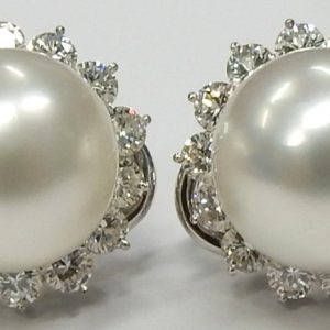 Estate Earrings With Pearls 
18 Karat White White Pearls Earrings 
 Gram Weight 10.8 
2 Center Pearls Shape: Round; Colour: White With 28 Round Diamonds 2.50 ctw