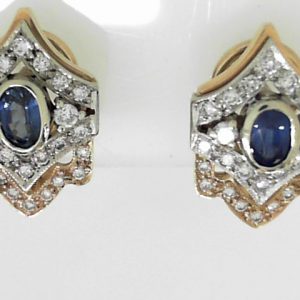 Estate Earrings With Sapphires 
14 Karat Yellow/White Blue Sapphires Earrings 
 Gram Weight 7.6 
2 Center Sapphires Shape: Oval; Colour: Blue With 50 Round Diamonds 0.76 ctw