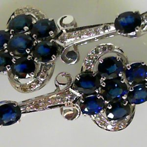 Estate Earrings With Sapphires 
18 Karat White Blue Sapphires Earrings 
 Gram Weight 16.5 
20 Center Sapphires Shape: Oval; Colour: Blue With 44 Round Diamonds 0.40 ctw