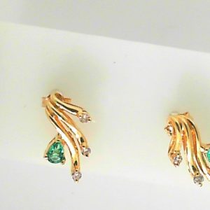Estate Earrings With Emeralds 
14 Karat Yellow Emeralds Earrings 
 Gram Weight 2.6 
2 Center Emeralds Shape: Pear With 6 Round Diamonds