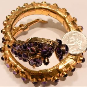 Estate Bracelet With Diamonds
14 Karat Yellow H/I Diamonds Bracelet
Gram Weight 66.1
6 Center Diamonds Shape: Round; Clarity: SI-I1; Colour: H/I With 31 Cabochon Amethysts and 2 Cabochon Garnets 0.15 ctw