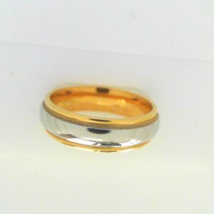 Yellow/White Platinum/18K Polished Band Ring Width 6 mm 
Size: 10 
Gram Weight 10.59 gr
