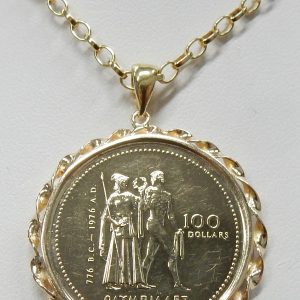 18kt. 18"  rolo chain 8.4 grams
14kt. ribbon frame 3.4 grams
14kt.1976 Montreal Olympic $100.00 coin 13.3 grams