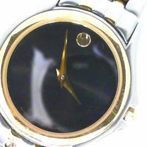 Two tone Movado Museum watch on bracelet with box and papers.