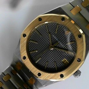 Mixed Estate Watch Audemars Piguet Dress 
Vendor Style #: Audemars Piguet 50023 Royal Oak quartz 171
35 18K/Stainless Steel Bracelet 
Dial:Grey hash
Box Not Included/Papers Not Included
Condition Excellent
1 Year Warranty