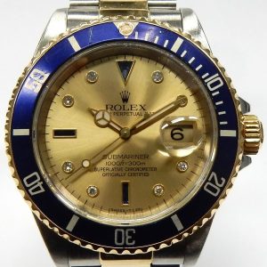 Estate Rolex Divers Year: 1990
Vendor Style #: 16613 Serti Sultan Submariner champagne dial with diamonds and sapphires SN: E404758 Oyster
40mmmm 18K/Stainless Steel
Dial: Champagne diamonds and sapphires 
Box Not Included/Papers Not Included
Conditi