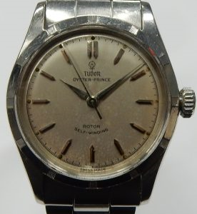 Estate Rolex Sport Year: 1955
Vendor Style #: 7909 Oyster-Prince SN: 153820 Oyster
34mmmm StainlessSteel
Dial: silver hash 
Box Not Included/Papers Not Included
Condition Fair
1 Year Warranty