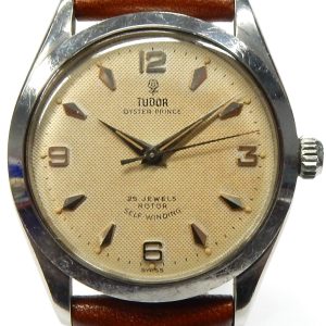 Estate Rolex Dress Year: 1959
Vendor Style #: Tudor Oyster Prince Explorer waffle dial SN: 278756 Strap
34.5mm StainlessSteel
Dial: Parchment Arabic arrow 
Box Not Included/Papers Not Included
Condition Good
1 Year Warranty