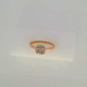 Diamond Engagement Ring 
14 Karat Rose/White Engagement Ring 0.69twt
Finger Size 6.5 
1 Center Diamond 0.59ct Shape: Round Clarity: I1 Colour: S Round Diamond 0.10 ctw 0.69
