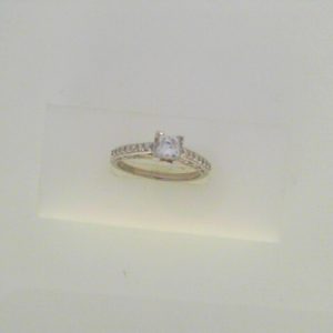 Diamond Engagement Ring 
18 Karat White Engagement Ring 0.73twt
Finger Size 6.5 
1 Center Diamond 0.53ct Shape: Princess Clarity: SI2 Colour: F Round Diamond 0.20 ctw 0.73