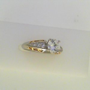 Diamond Engagement Ring 
22K/Platinum Yellow/White Engagement Ring 0.65twt
Finger Size 5.5 Gram Weight 5gram weight Width: 2.4 
1 Center Diamond 0.53ct Shape: Round Clarity: VVS1 Colour: G/H With 6 Round Diamonds 0.12 ctw 0.65