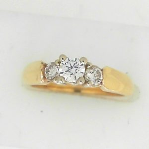 Diamond Engagement Ring 
14 Karat Yellow Engagement Ring 0.31twt
Finger Size 5.5 Gram Weight 3.89gram weight 
1 Center Diamond 0.20ct Shape: Round Clarity: SI2 Colour: F With 2 Round Diamonds 0.11 ctw 0.31