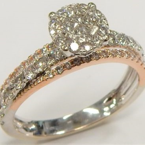 Estate Diamond Engagement Ring 
14 Karat Estate Engagement Ring Width 2.9mm 
Finger Size 7.25 Gram Weight 3.3 
66 Center Diamonds Shape: Round; Clarity: I1; Colour: H/I 1