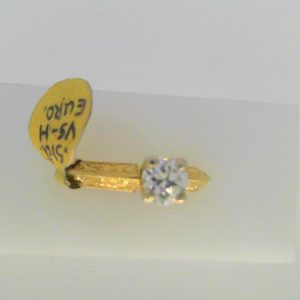 Estate Diamond Engagement Ring 
18 Karat Yellow/White Estate Engagement Ring Width 3.03mm 
Finger Size 6.5 Gram Weight 4.69 
1 Center Diamond 0.51ct Shape: Round; Clarity: VS1; Colour: H 0.51