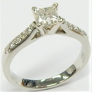 Estate Diamond Engagement Ring 
19 Karat White Estate Engagement Ring Width 2.3mm 
Finger Size 5.5 Gram Weight 6.37 
1 Center Diamond 0.52ct Shape: Princess; Clarity: SI1; Colour: G/H With 23 Round Diamonds 0.33 ctw 0.85