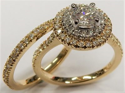 Estate Diamond Engagement Ring 
14 Karat Yellow/White Estate Engagement Ring 
Finger Size 4 Gram Weight 4.6 
1 Center Diamond 0.40ct Shape: Round; Clarity: SI1; Colour: D With 40 Round Diamonds 0.40 ctw 0.8