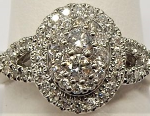 Estate Diamond Engagement Ring 
10 Karat White Estate Engagement Ring Width 1.6mm 
Finger Size 4.75 Gram Weight 3.3 
68 Center Diamonds Shape: Round; Clarity: I1; Colour: I 0.33