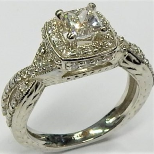 Estate Diamond Engagement Ring 
18 Karat White Estate Engagement Ring Width 2.3mm 
Finger Size 5.5 Gram Weight 6 
69 Center Diamonds Shape: Various Shapes 1.14