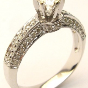 Estate Diamond Engagement Ring 
18 Karat White Estate Engagement Ring Width 3.1mm 
Finger Size 6.75 Gram Weight 3.8 
51 Center Diamonds 0.25ct Shape: Round; Clarity: SI1; Colour: F 0.33