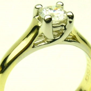 Estate Diamond Engagement Ring 
18 Karat Yellow/White Estate Engagement Ring Width 3mm 
Finger Size 5 Gram Weight 4.3 
1 Center Canadian Diamond 0.38ct Shape: Round; Clarity: SI2; Colour: E 0.38