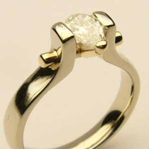 Estate Diamond Engagement Ring 
14 Karat Yellow/White Estate Engagement Ring Width 3.3mm 
Finger Size 7.75 Gram Weight 4.3 
1 Center Diamond 0.43ct Shape: Pear; Clarity: SI2; Colour: H 0.43