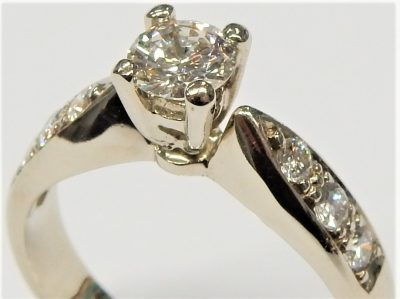 Estate Diamond Engagement Ring 
14 Karat White Estate Engagement Ring 
Finger Size 5.5 Gram Weight 3.5 
1 Center Diamond 0.37ct Shape: Round; Clarity: SI1; Colour: I With 6 Round Diamonds 21.00 ctw 21.37