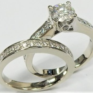 Estate Diamond Engagement Ring 
14 Karat White Estate Engagement Ring 
Finger Size 4.75 Gram Weight 5.2 
1 Center Diamond 0.64ct Shape: Round; Clarity: I2; Colour: I/J With 37 Round Diamonds 0.36 ctw 1