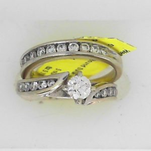 Estate Diamond Engagement Ring 
14 Karat White Estate Engagement Ring 
Finger Size 5.75 Gram Weight 5.6 
 Center Canadian Diamond Shape: Round; Clarity: I1; Colour: I 0.91