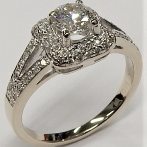 Estate Diamond Engagement Ring 
14 Karat White Estate Engagement Ring 
Finger Size 4.75 Gram Weight 5.4 
1 Center Diamond 0.48ct Shape: Round; Clarity: SI1; Colour: J With 72 Round Diamonds 0.22 ctw and 17 Round Diamonds 0.17 ctw 0.87