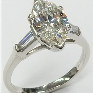 Estate Diamond Engagement Ring 
Platinum White Estate Engagement Ring 
Finger Size 5.75 Gram Weight 3.9 
1 Center Diamond 2.11ct Shape: Marquise; Clarity: VS1; Colour: F; GIA 5202764862 With 2 Baguette Diamonds 0.20 ctw 2.31